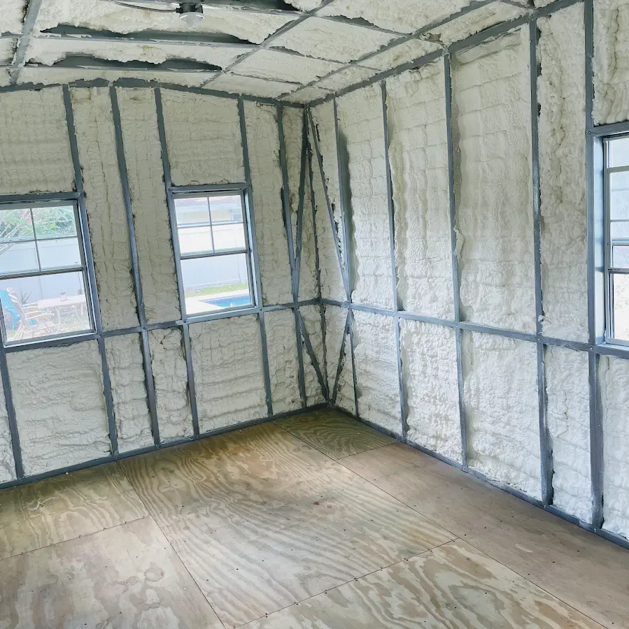 Closed-cell spray foam insulation applied to wall cavities in a residential project in Walton